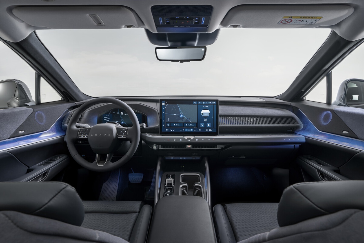 Interior of a Toyota electric SUV with digital cockpit and central touchscreen.