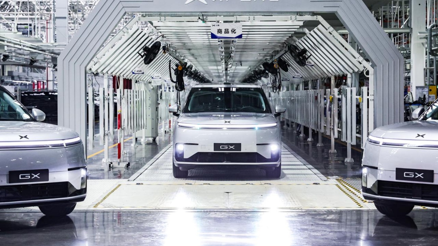 XPENG GX vehicles on assembly line inside a modern car factory.