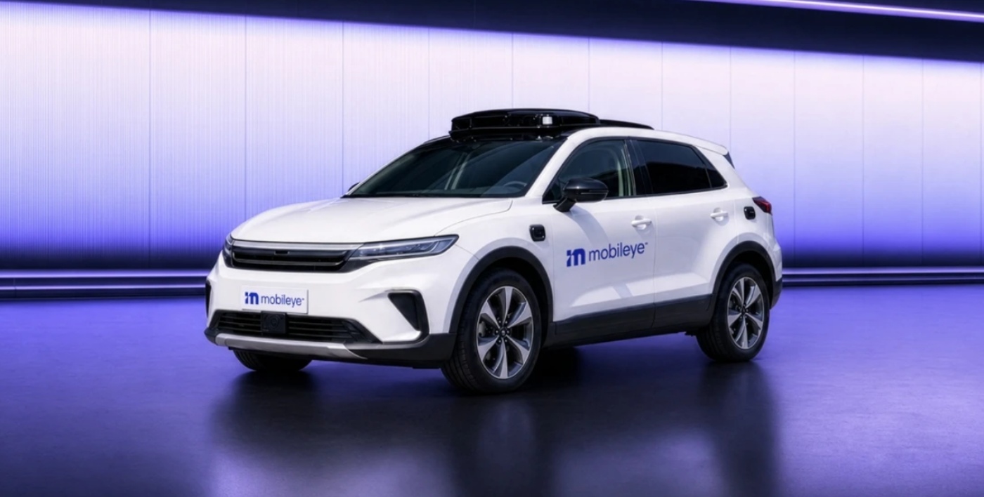 Mobileye autonomous test vehicle displayed in a modern indoor setting.
