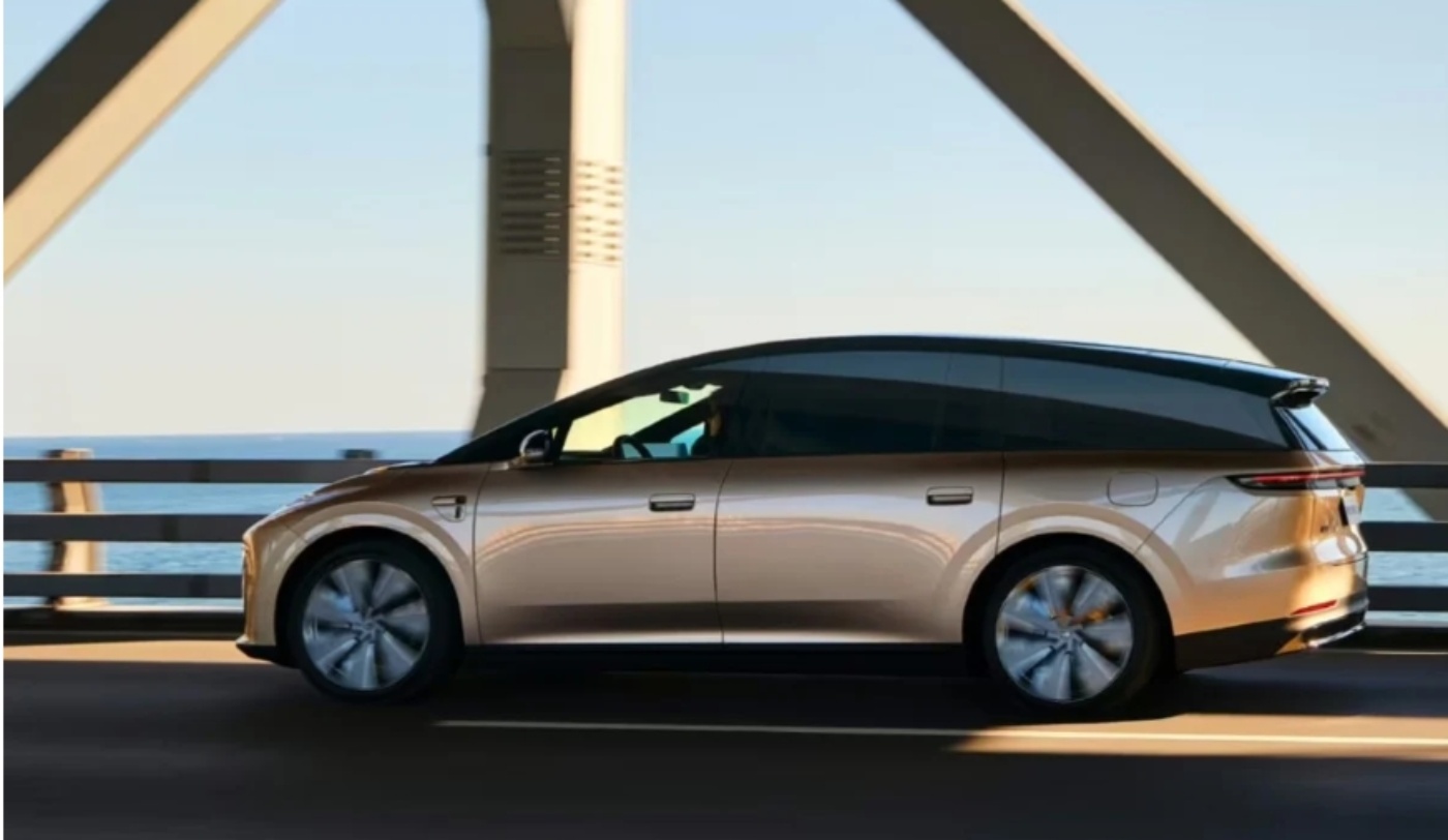 Beige Li Auto vehicle driving across a bridge.