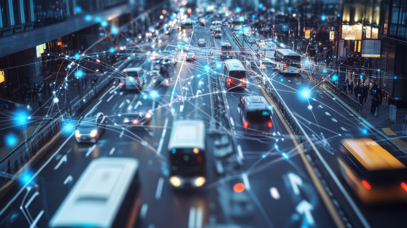 Busy city street with buses and cars, overlaid with glowing digital network connections.